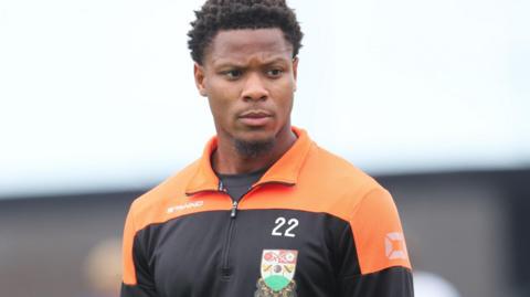 Adebola Oluwo warming up for Barnet