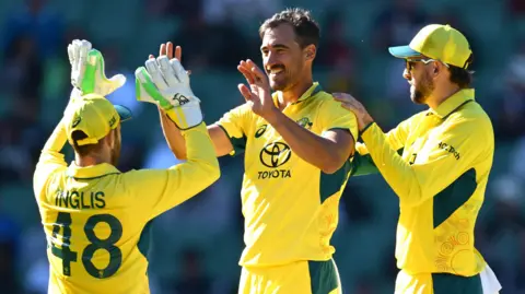 Mitchell Starc celebrates a wicket