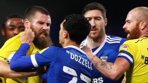 Ipswich and Burton players clash