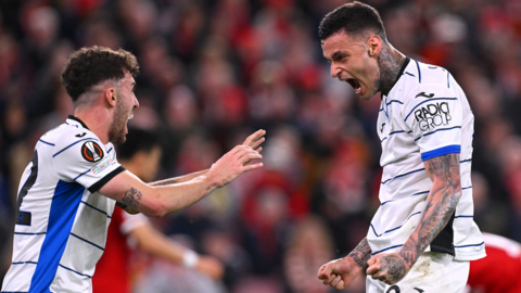 Atalanta's players celebrate scoring against Liverpool at Anfield in the Europa League quarter-final