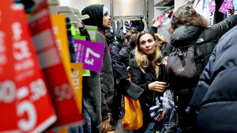 Shoppers inside the Next store on Princes Street, Edinburgh, shortly after it opened for the Boxing Day sales