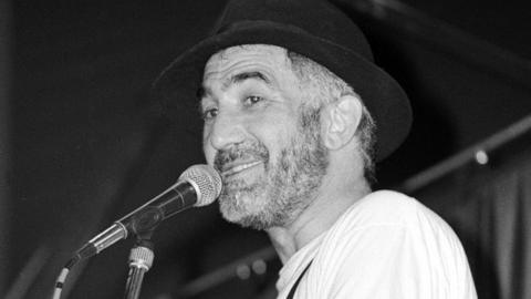 Comedian Tony Allen performs on stage at Glastonbury Festival, United Kingdom, 1990.