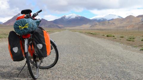 Long distance cycling on M41 Pamir Highway, Pamir Mountain Range, Tajikistan. File image