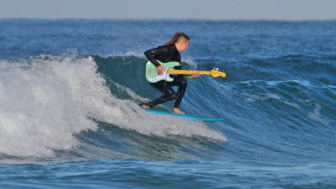 Surfing guitarist