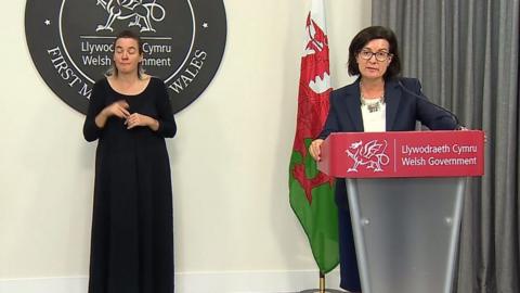 Eluned Morgan and sign language interpreter