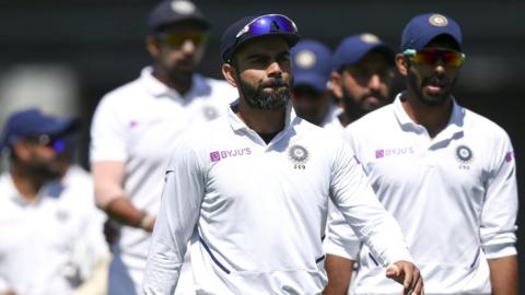 India captain Virat Kohli looking dejected after his side's defeat by New Zealand