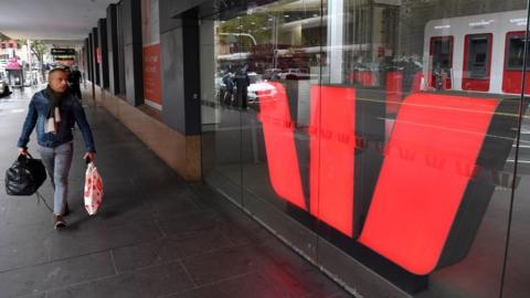 A man walks past a Westpac bank branch in Melbourne