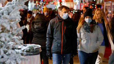 A man and a woman at a Christmas fair