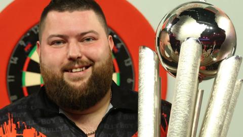 Michael Smith with the World Championship trophy