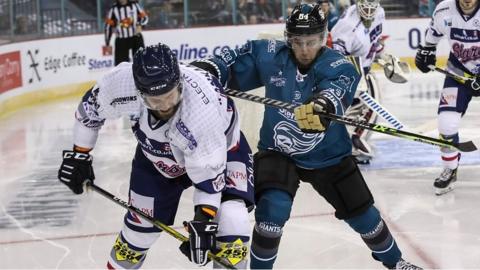 Belfast Giants David Goodwin with Dundee Stars Markus Kankaanpera