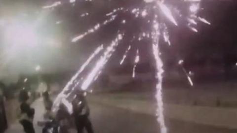 Police being attacked with fireworks