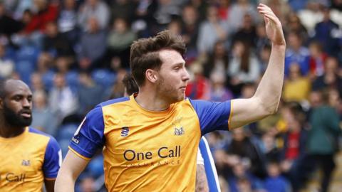 Riley Harbottle celebrates with Mansfield Town