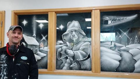 Paddington snow window with artist Tom Baker
