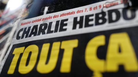 Cropped image of headline on Charlie Hebdo issue released at the start of September