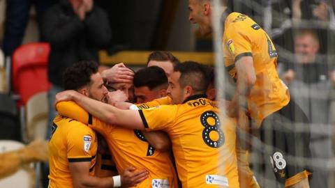 Newport players celebrate Scot Bennett's goal