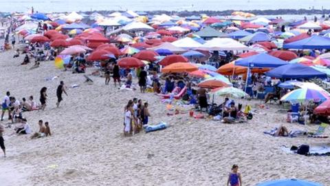 Bathers at the beach in Ocean City, Maryland, 22 July 2017