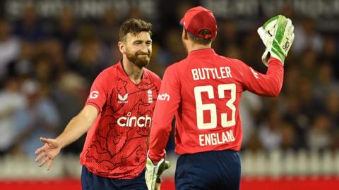 England players celebrate a wicket