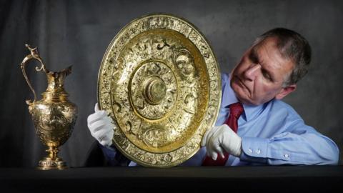 Dr Godfrey Evans with the Panmure ewer and basin