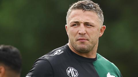 Sam Burgess watches on at a South training session