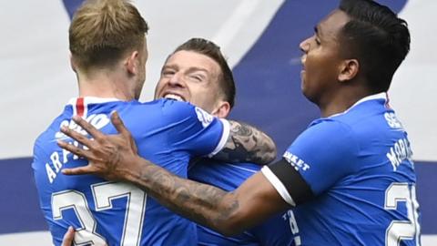 Steven Davis (centre) celebrates scoring