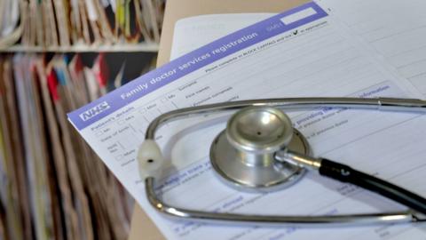 A stethoscope on a patient GP form