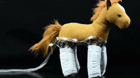 A horse toy with robotic legs.