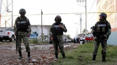 Members of the National Guard remain near the crime scene where more than two dozen people were killed in Irapuato, Guanajuato state, Mexico, on July 1, 2020