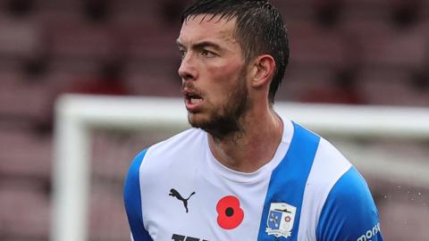 Niall Canavan of Barrow AFC in action during the Emirates FA Cup First Round match between Northampton Town and Barrow at Sixfields on November 04, 2023 in Northampton, England