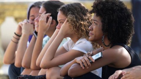 Women react a day after a massive fire ripped through the museum on 3 September 2018