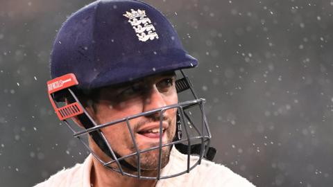 Alastair Cook looks on