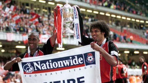 Darren Byfield (left) celebrates winning promotion with Walsall in the Division Two play-off final in 2001