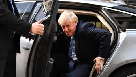 Boris Johnson gets out of his car