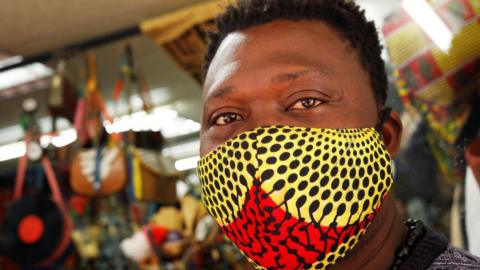 Man wearing face mask inside shop in Cape town