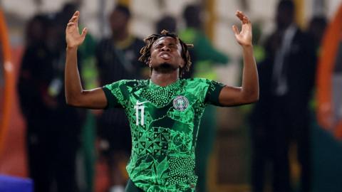 Samuel Chukwueze celebrates after Nigeria beat South Africa on penalties