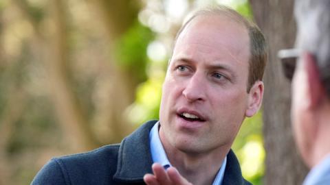Prince William during visit to food redistribution charity in Surrey