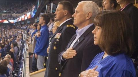 Mike Pence tweeted a photo of himself standing during the US national anthem at an NFL game on Sunday, 8 October 2017