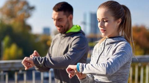 Couple wearing fitness trackers