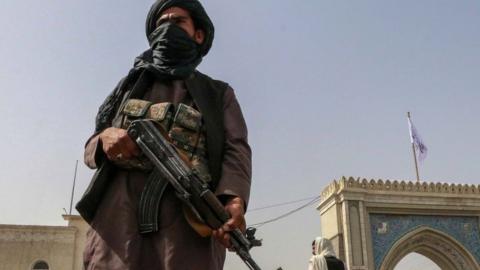 Afghanistan crisis / Taliban resurgence: Armed Taliban (or Taleban) militia fighter stands guard at a checkpoint in Kandahar, Afghanistan, 17th August 2021.