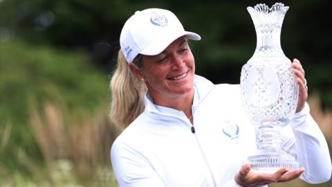 Suzann Pettersen poses with the Solheim Cup