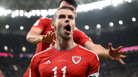 Gareth Bale celebrates after scoring Wales' equaliser