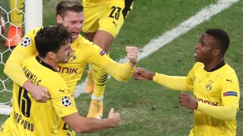 Borussia Dortmund's players celebrate scoring against Zenit St Petersburg in the Champions League