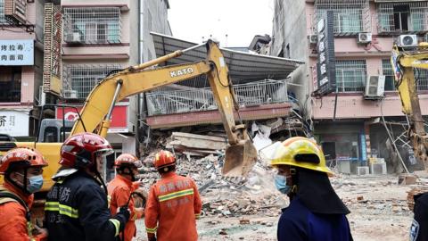 Rescuers work at the collapse site of a self-constructed residential building on April 29, 2022 in Changsha, Hunan Province of China. The incident took place on Friday in Wangcheng District in Changsha