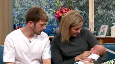 Tom Evans and Kate James with baby Thomas