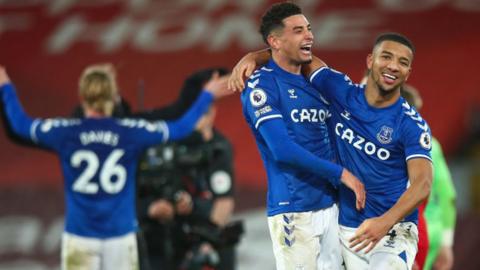 Everton players celebrate their win at Anfield