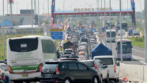 four lanes of traffic backed up all the way to a junction in Indonesia
