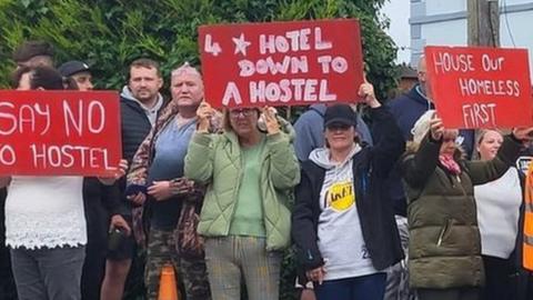 Protesters outside the site