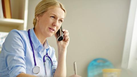 Doctor on phone (stock image)