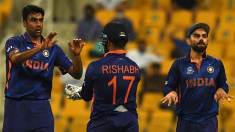India players Ravichandran Ashwin (left), Rishabh Pant (centre) and Virat Kohli (right) celebrate taking a wicket against Afghanistan