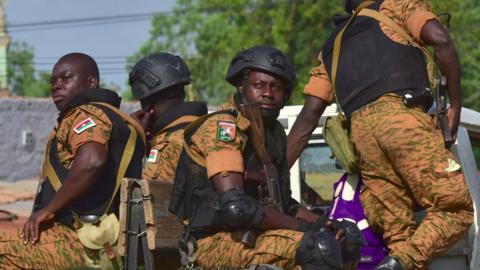 A picture take in Octtober 2018 shows Burkinabe gendarmes sitting on their vehicle in the city of Ouhigouya in the north of the country.