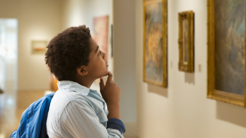 Boy looking at art